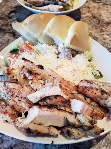 Greek Salad Chicken at Dinakis Mediterranean Grill Port Coquitlam BC - Fresh Greek salad topped with perfectly seasoned grilled chicken breast