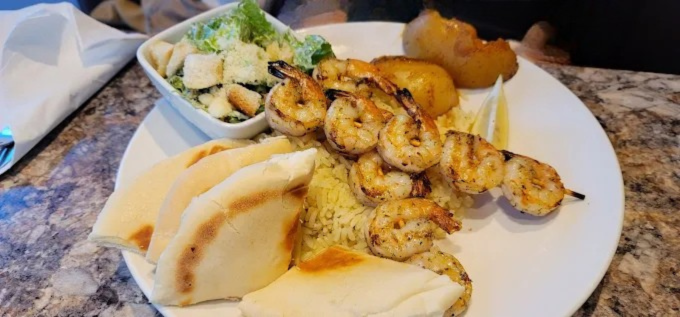 Prawn Souvlaki Dinner at Dinakis Mediterranean Grill Port Coquitlam BC - Succulent prawns marinated and grilled on skewers, served with traditional sides
