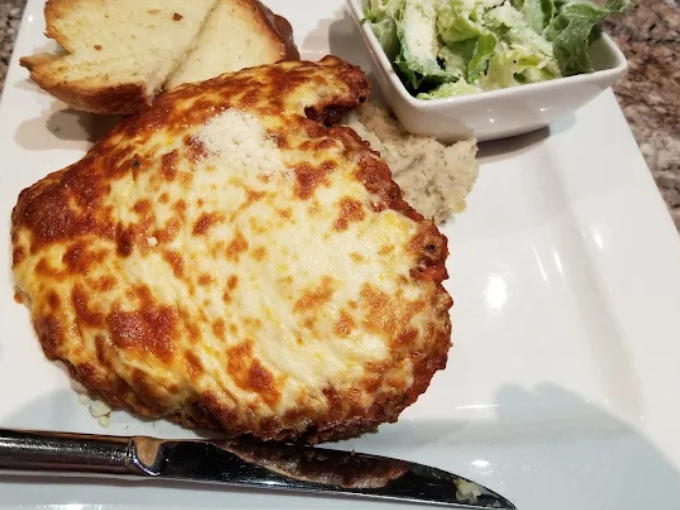 Side Chicken Parmesan at Dinakis Mediterranean Grill Port Coquitlam BC - Crispy breaded chicken breast topped with marinara sauce and melted cheese